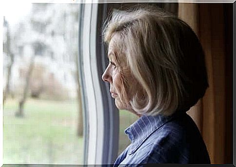 about prejudice - elderly woman looks out the window