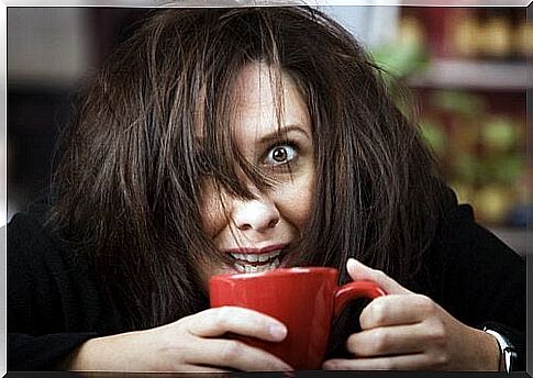 A woman is hyperactive after drinking coffee.