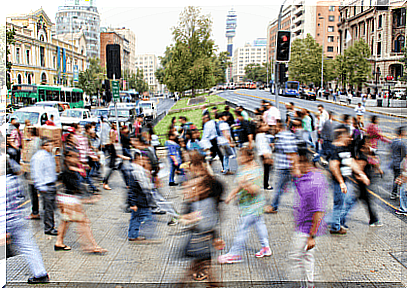 Many people cross a street