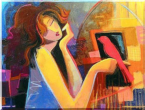 Woman with a red bird on her hand