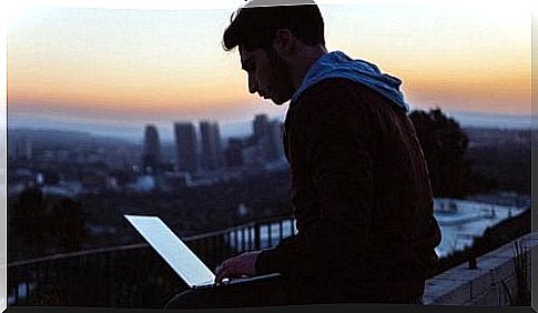 Young man works with the computer