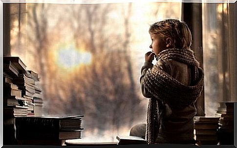 Boy with scarf at the window