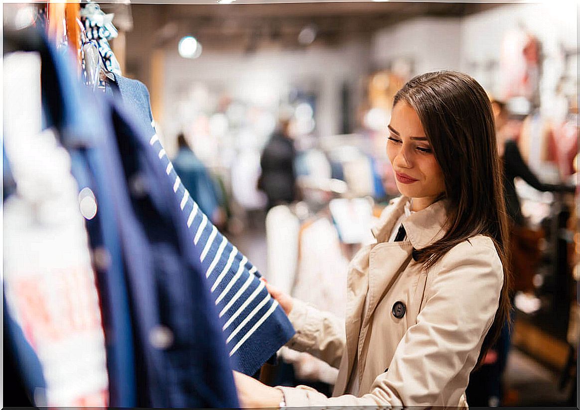 Music in clothing stores - woman shopping