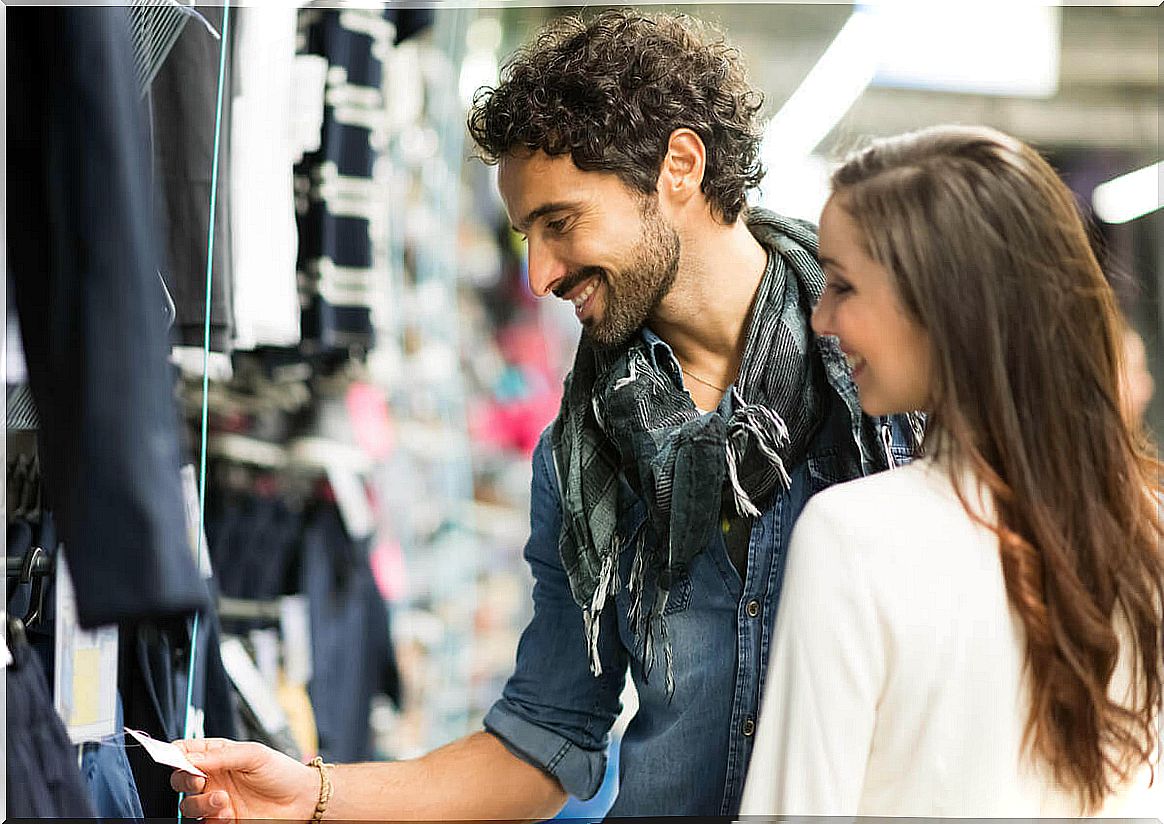 Music in clothing stores - couple shopping