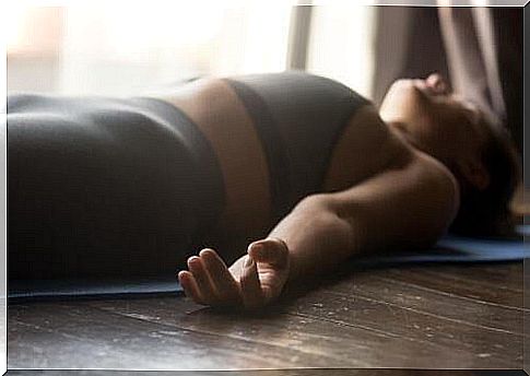 Woman relaxes lying on the floor