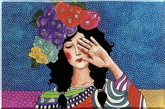 Woman with colorful flowers on her head holds her hand in front of her face