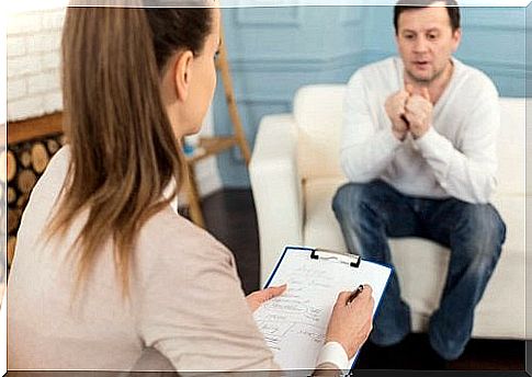 A psychologist speaks to a patient.